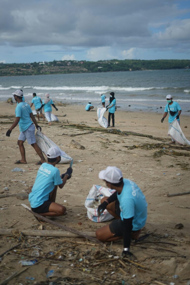 Volunteers Cleaning up plastic waste from a beach